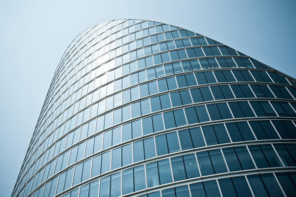 london architecture: classic modern bent building facadeRELEVANT LIGHTBOXES LONDON + NYC